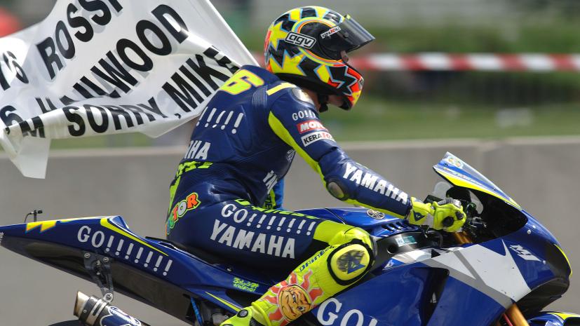 Valentino Rossi celebrates matching Mike Hailwood's record of 76 wins